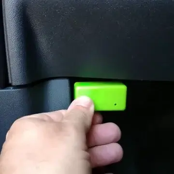 Locate the OBD2 port under the steering wheel